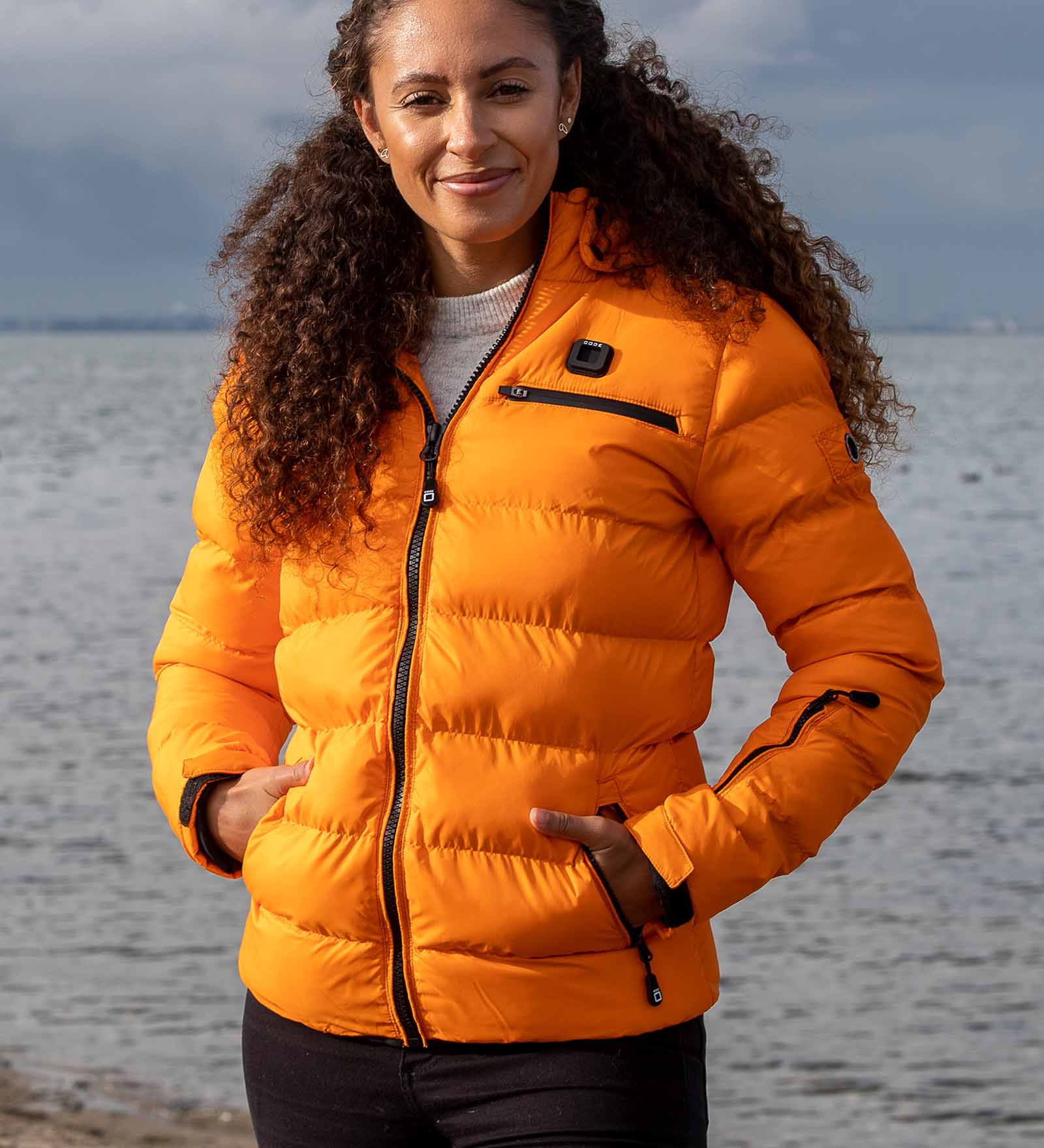 https://www.code-zero.com/uploads/media/c9/b2/6b/1667815746/winter-jacket-puffer-monte-baldo-women-orange-model.jpg